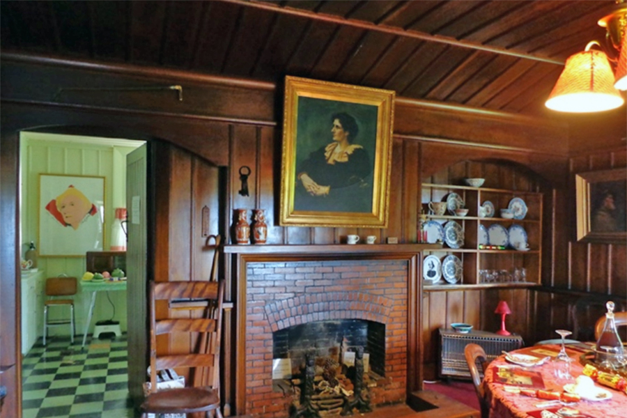 Dining Room at marton Cottage with portait of Ngaio Marsh